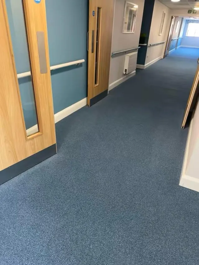 Another hallway with a freshly cleaned carpet